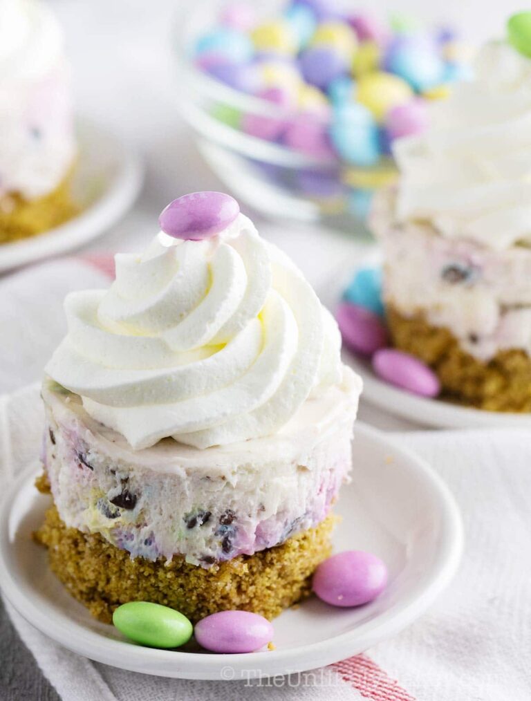mini easter cheesecake in a plate with m&m pastel chocolate