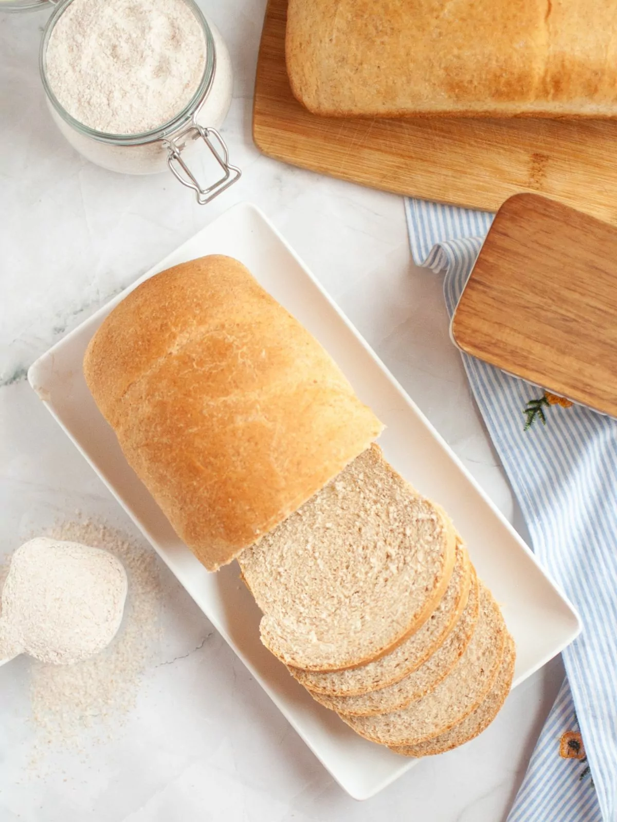 overhead view of a loaf of bread that's been sliced halfway