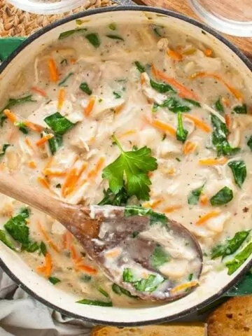 Sunday dinner chicken and dumplings in Dutch oven with wooden spoon MSN.