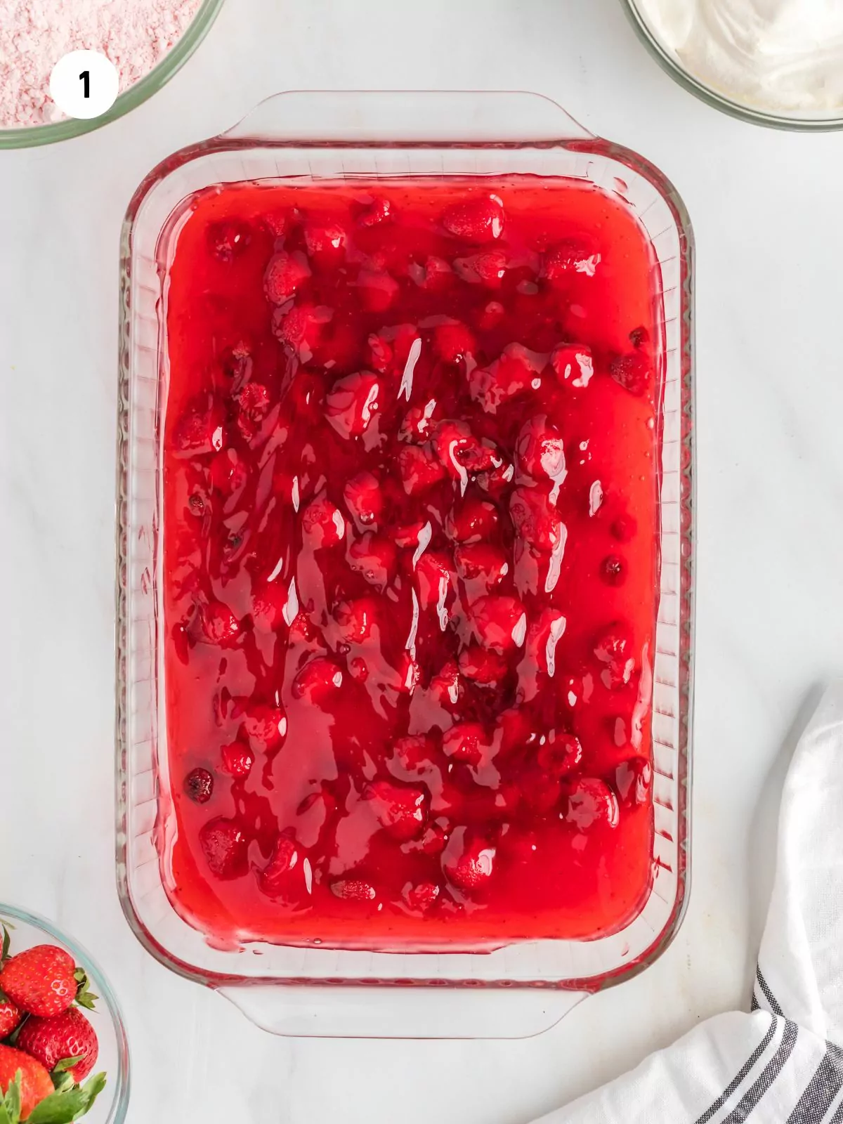 strawberry pie filling in baking dish