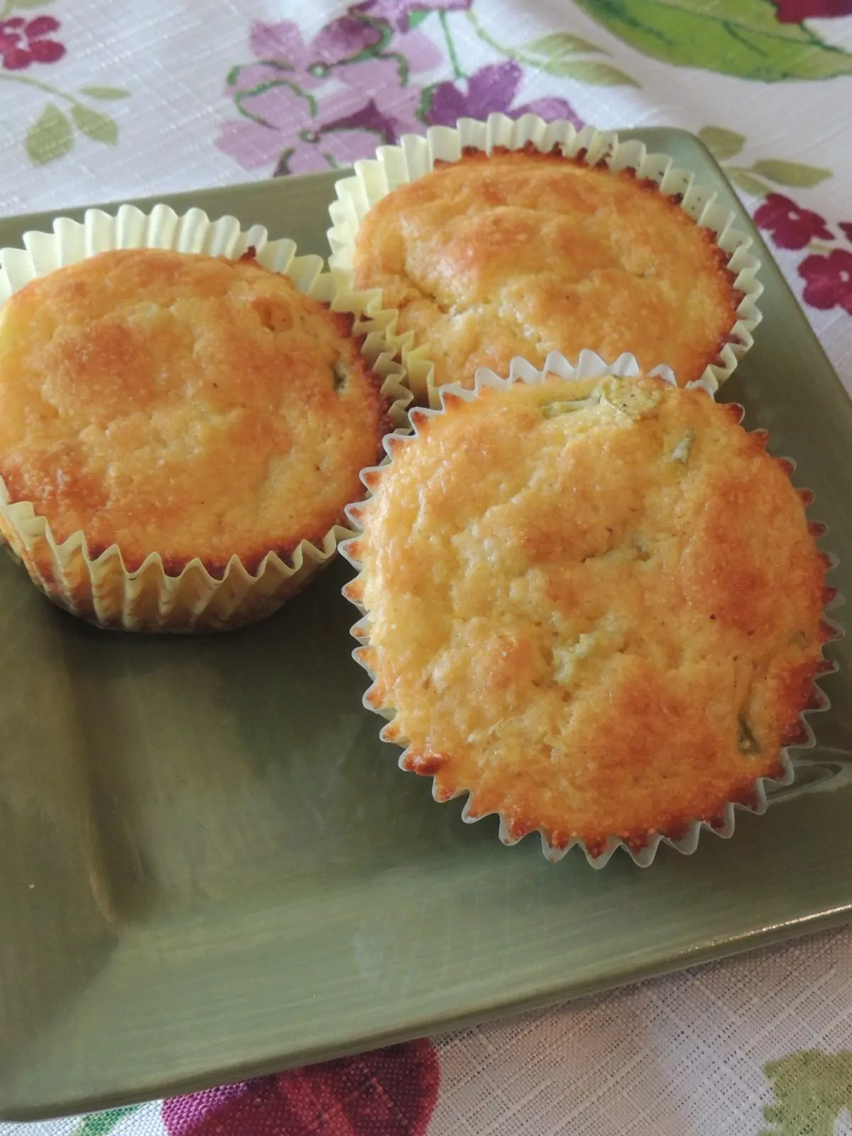 3 baked muffins made with Jiffy Corn Muffin Mix.