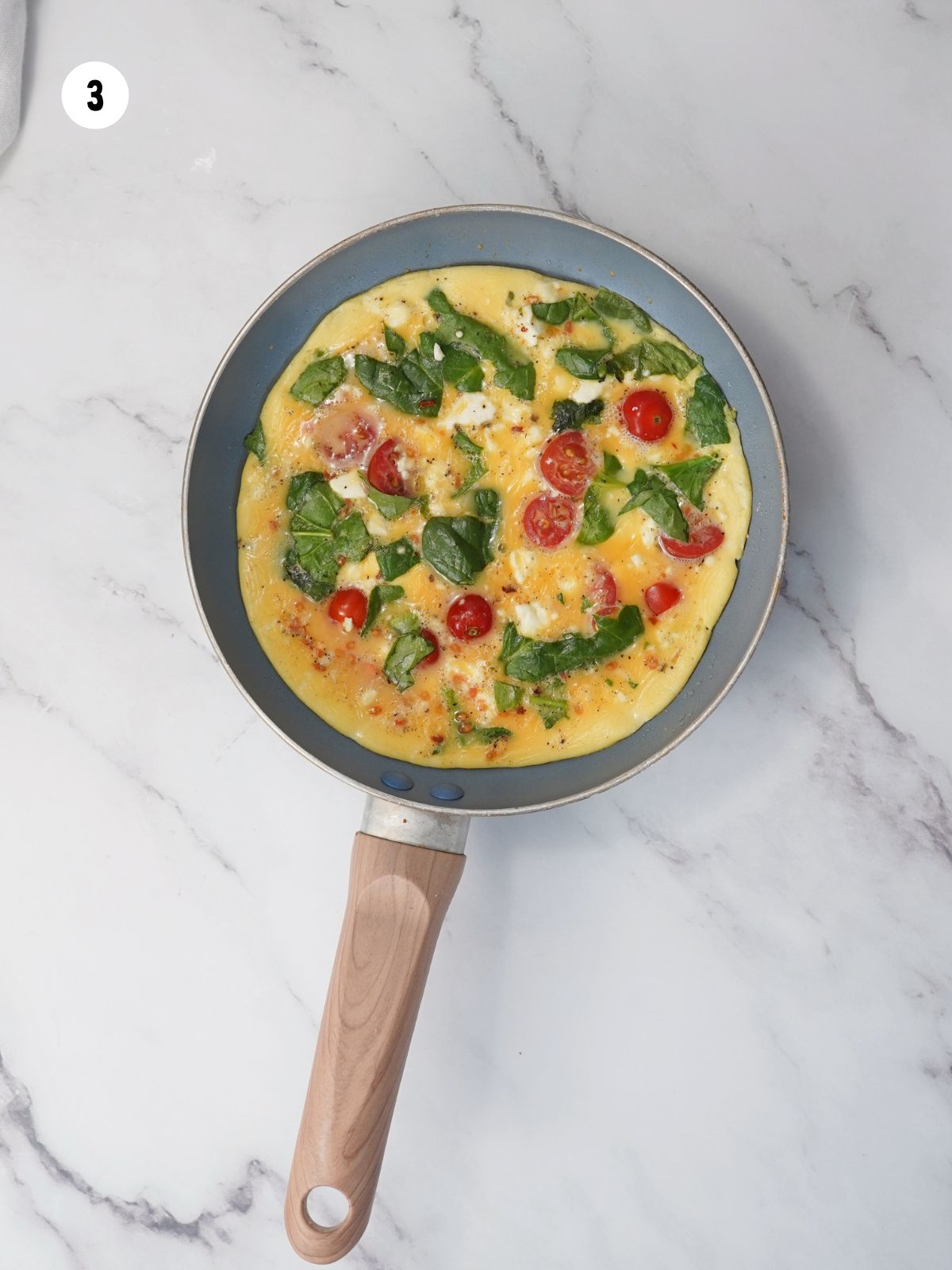 omelette cooking in a pan