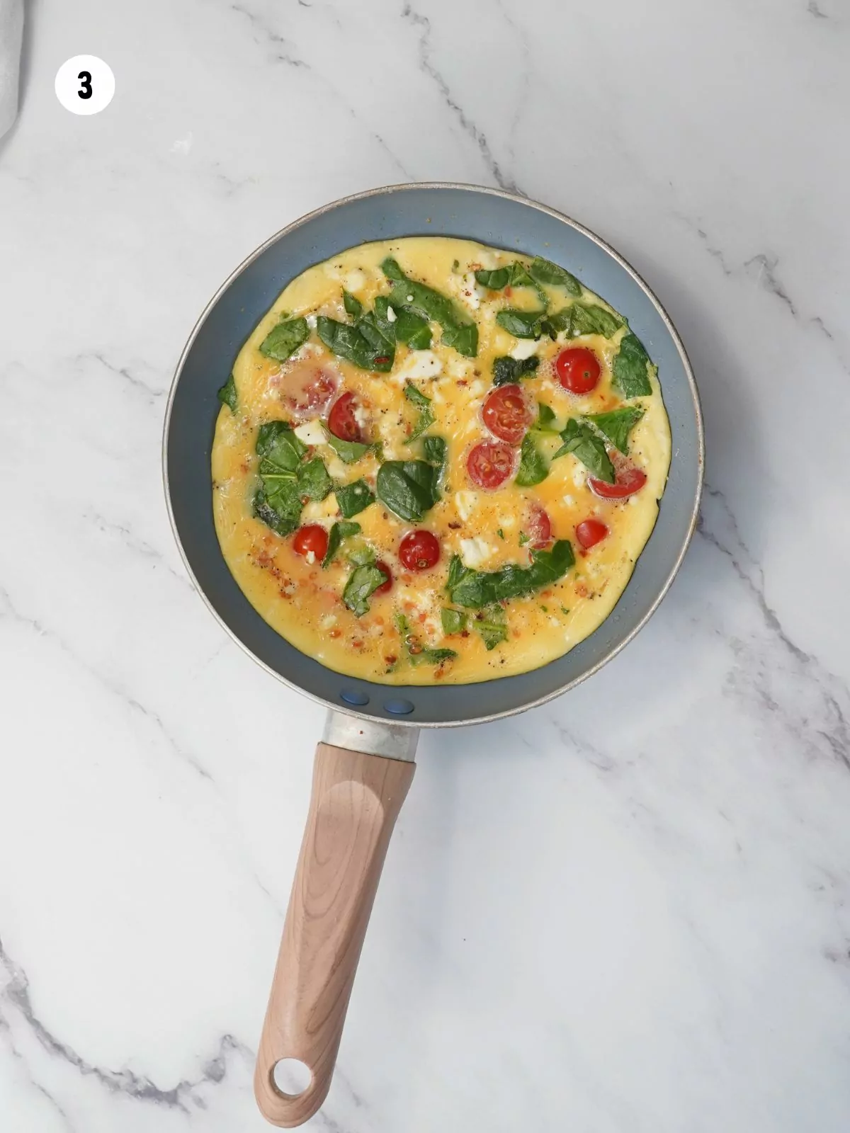 omelette cooking in a pan