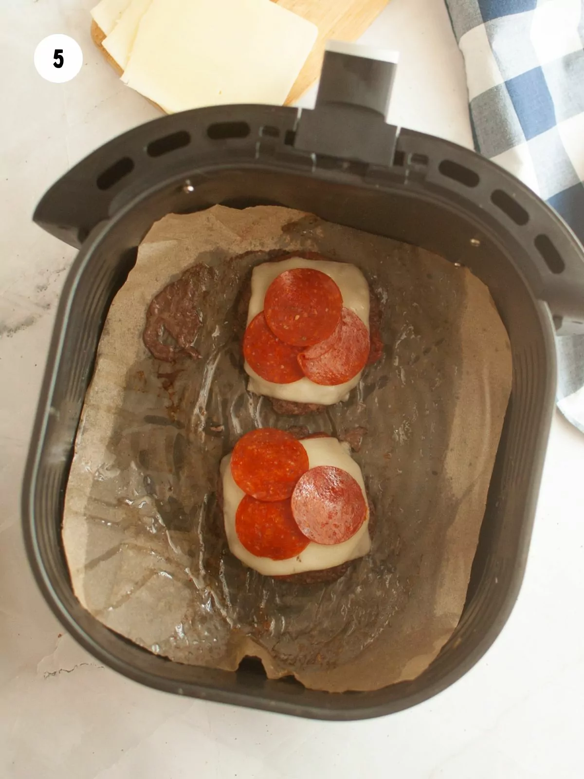 pepperoni added on top of the cheese