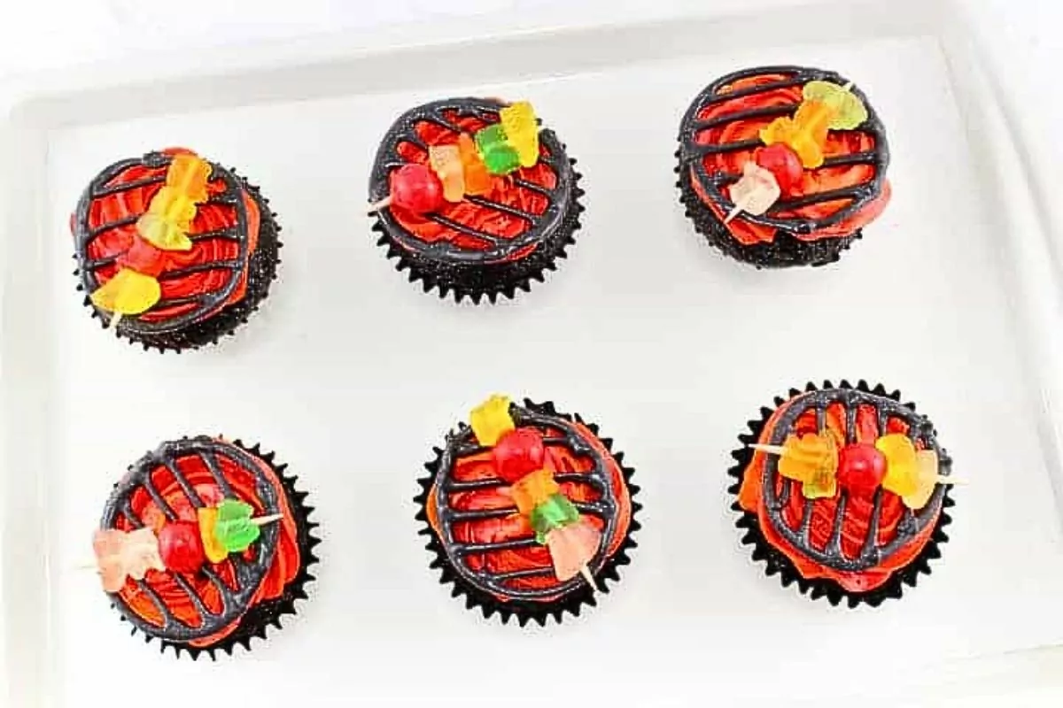 cute cupcakes decorate like a bbq grill.