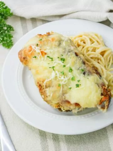 Baked Chicken Cutlet Alfredo served with pasta
