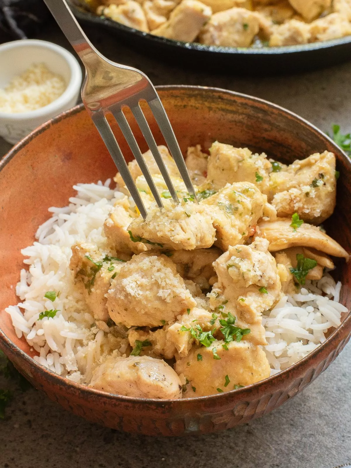 fork piercing a garlic chicken bite