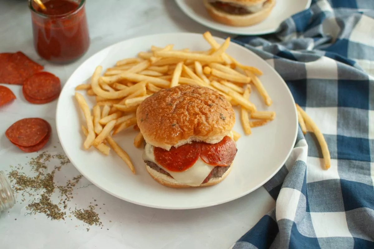 plate of fries and a pizza burger