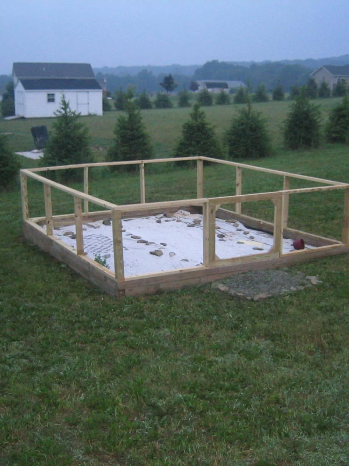 beginner garden completely built with drop cloth on top of ground.