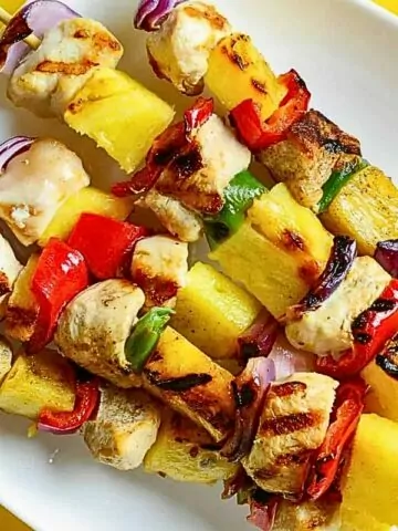 grilled chicken with vegetables and pineapple.
