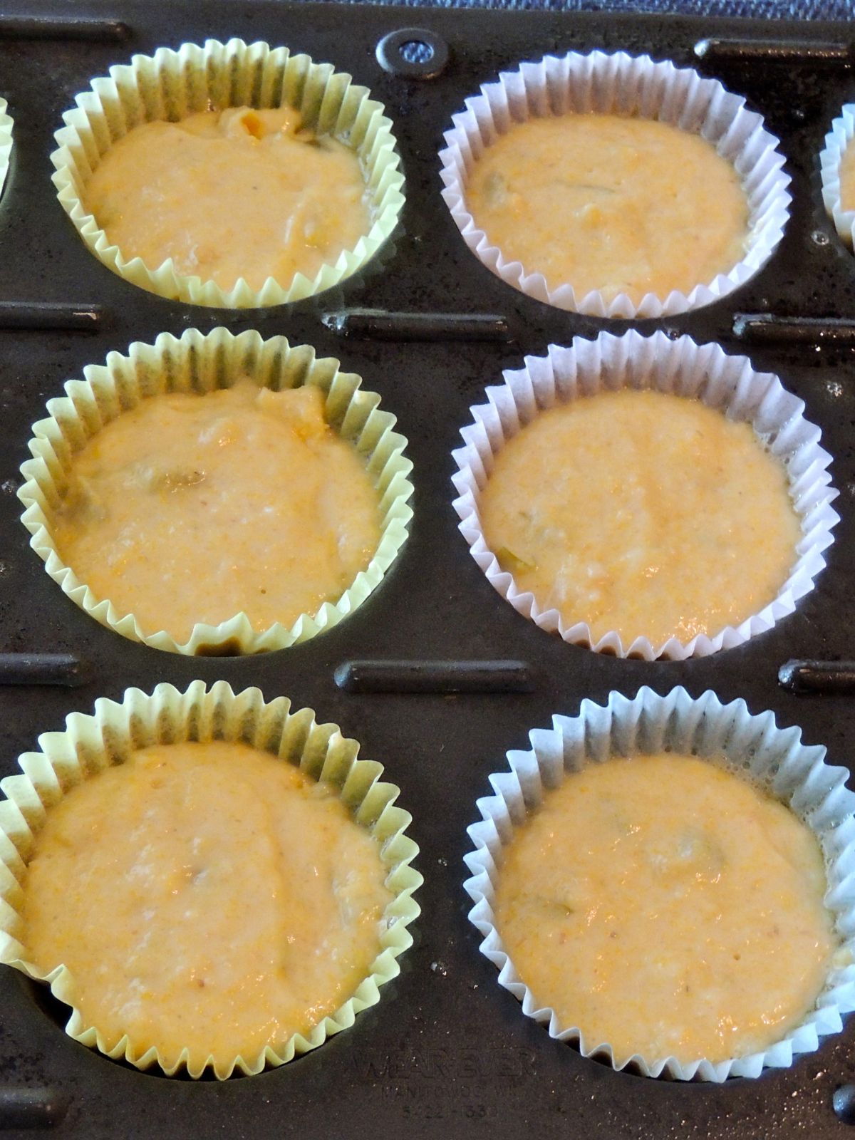 corn muffins in baking tray before baking.