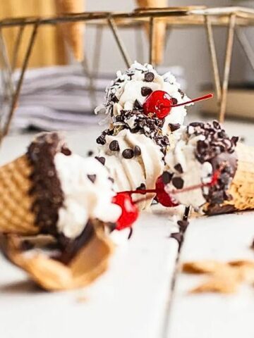 frozen ice cream cone treats with cherries.