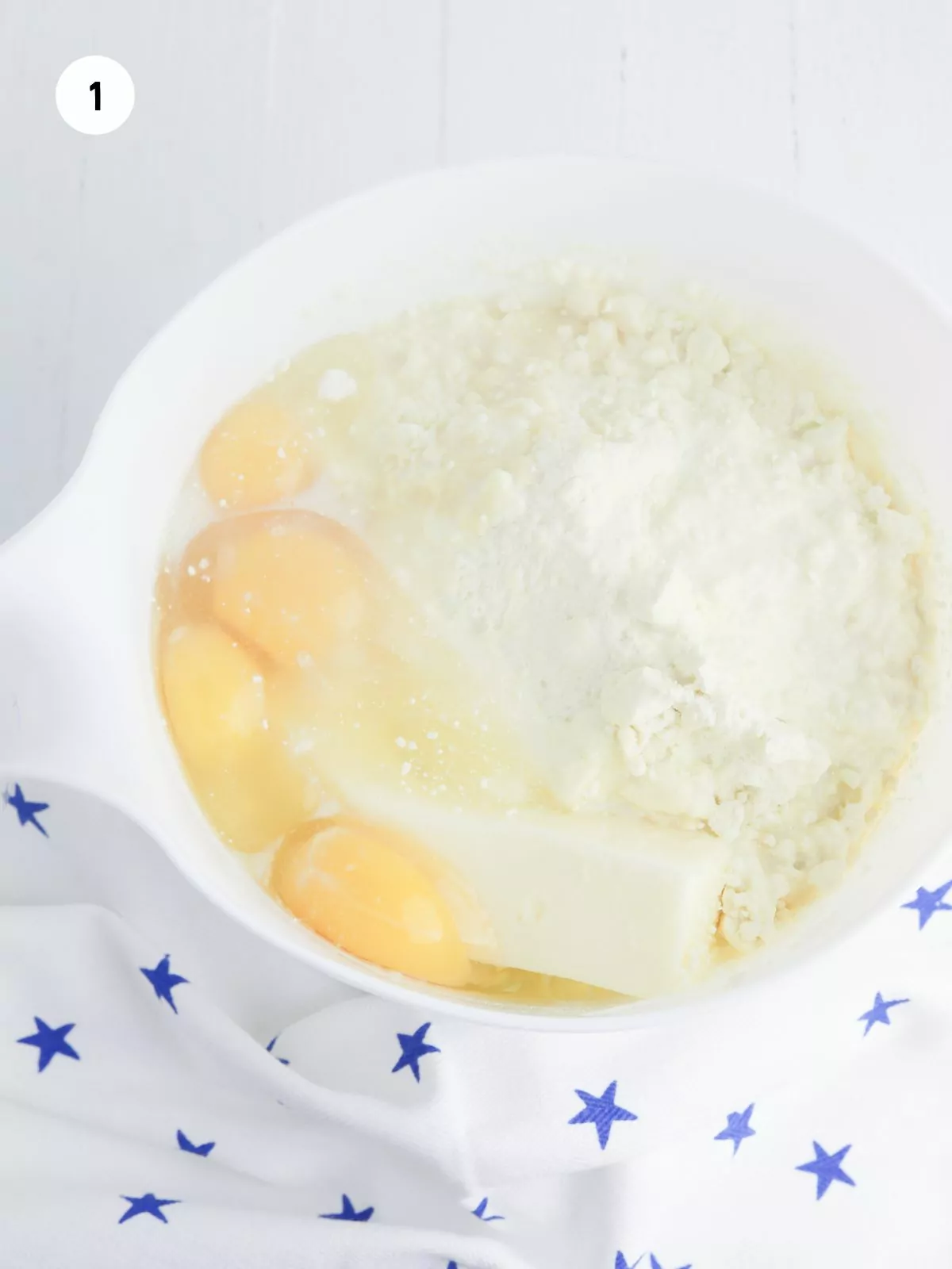 Ingredients for the cake in a white mixing bowl.