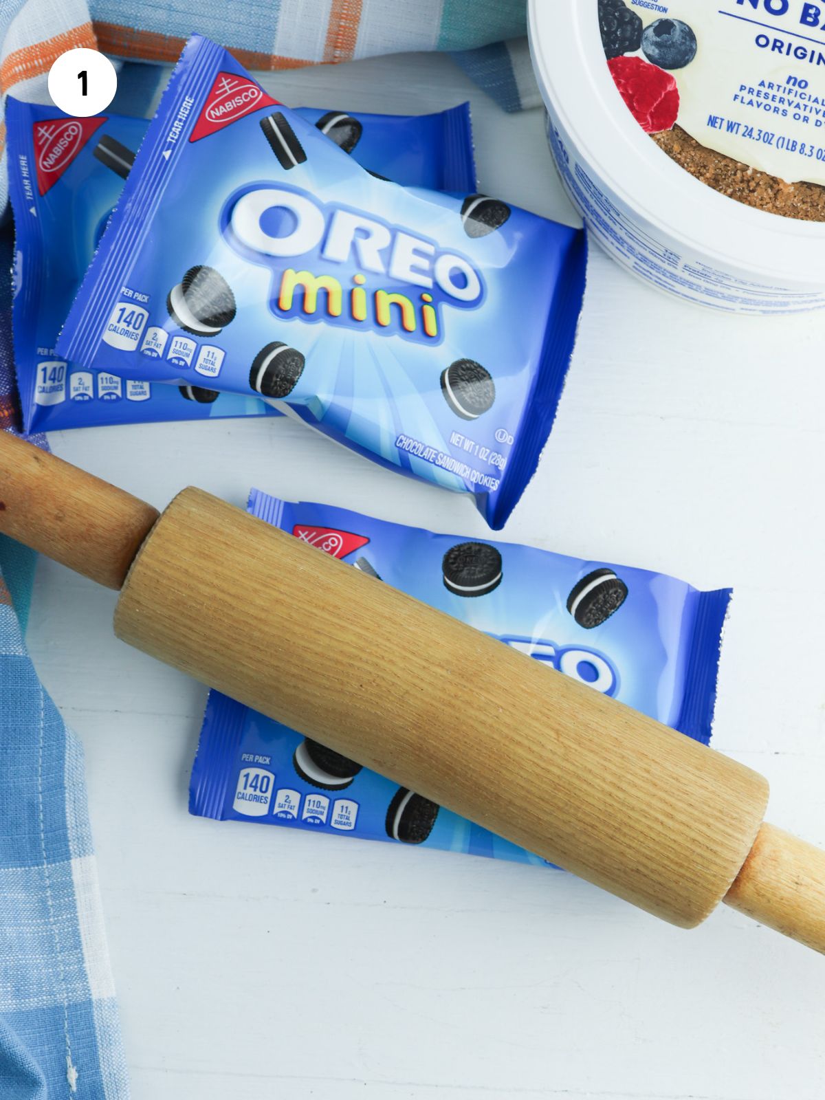 rolling pin crushing the oreos inside the bag