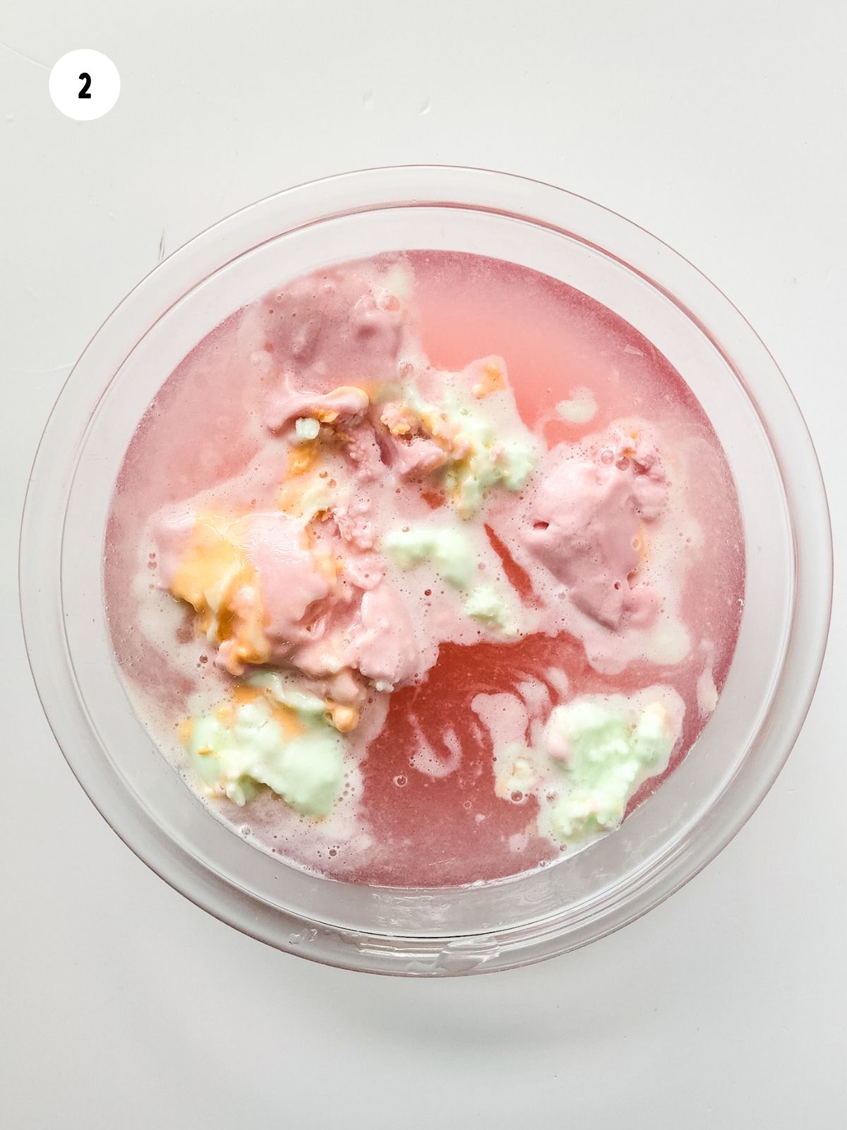 sherbet added to the juices in the punch bowl