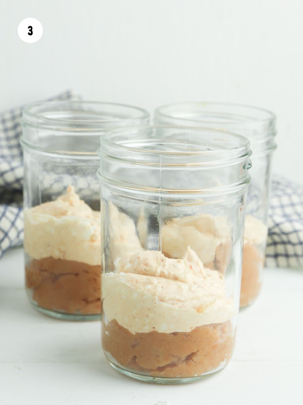 cream cheese mixture layered on top of the beans
