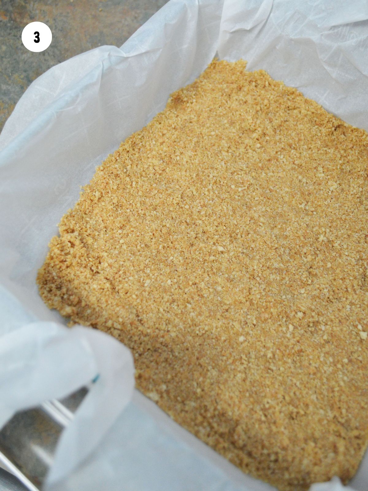 crust pressed into a parchment lined baking pan