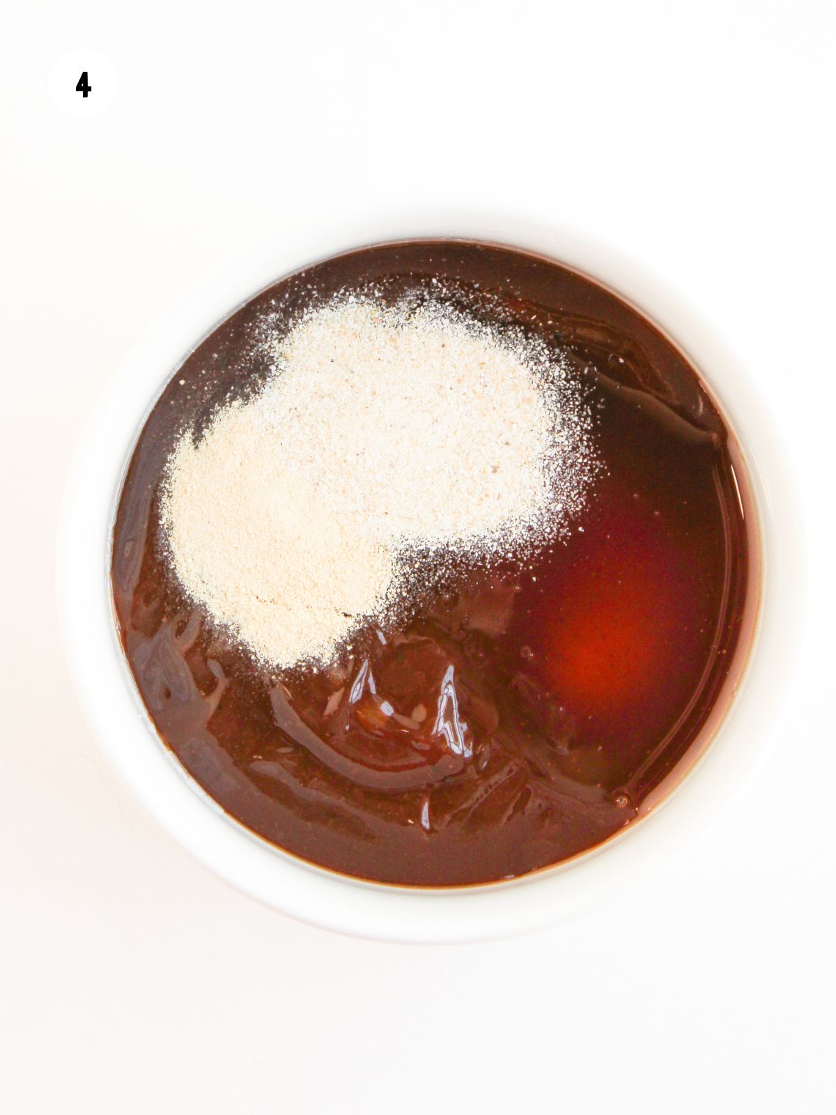 BBQ sauce, honey, onion and garlic powder in a bowl.