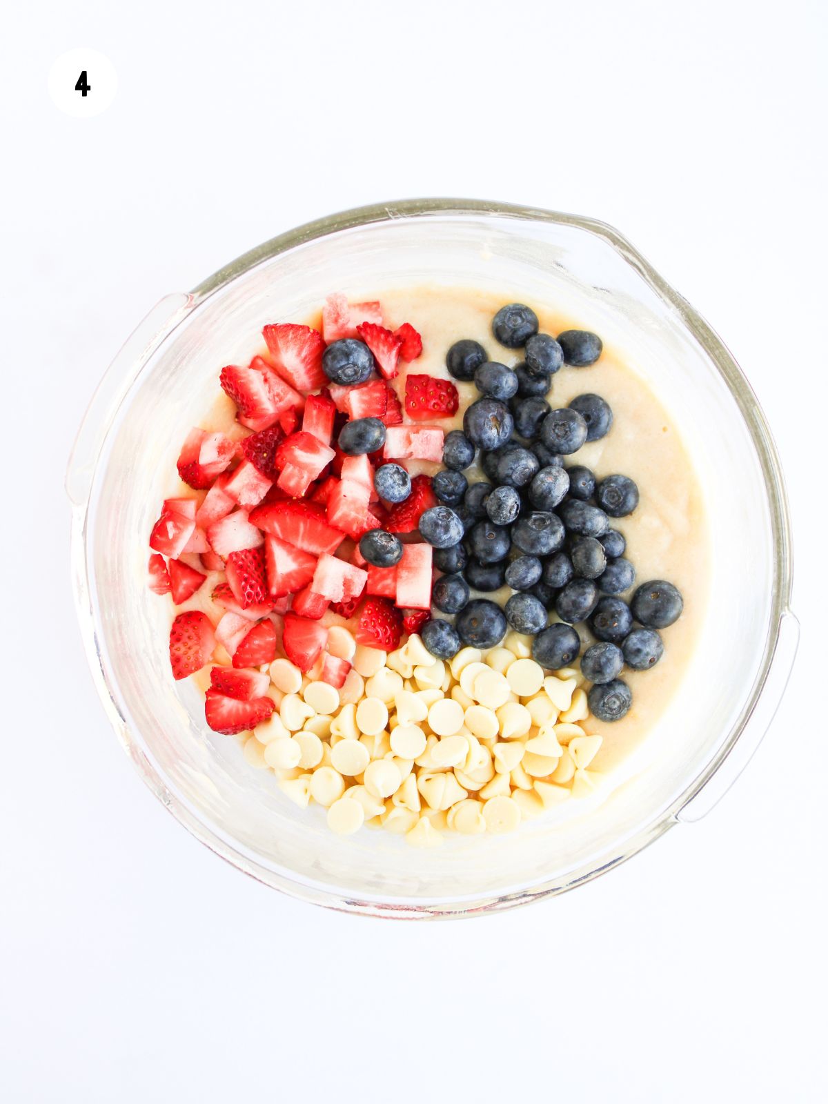 chopped strawberries, blueberries, and white chocolate chips added to the muffin batter