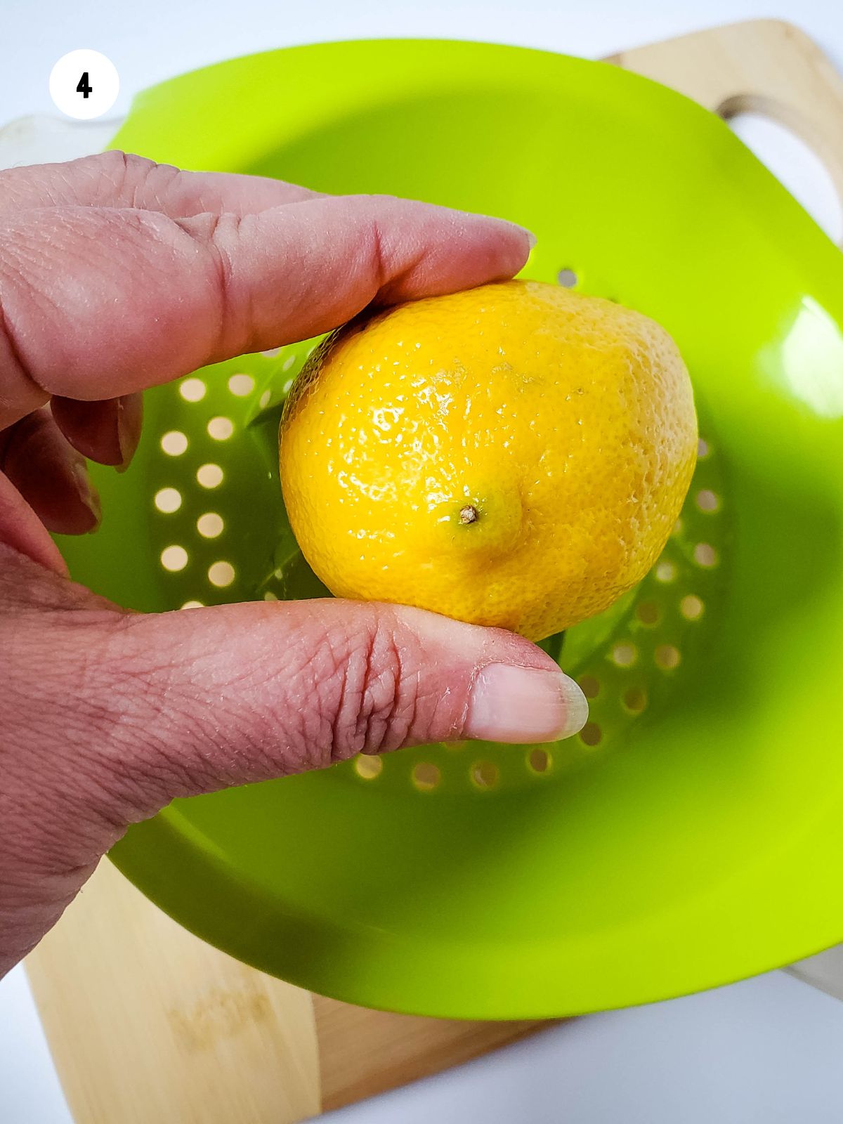 lemon half being juiced