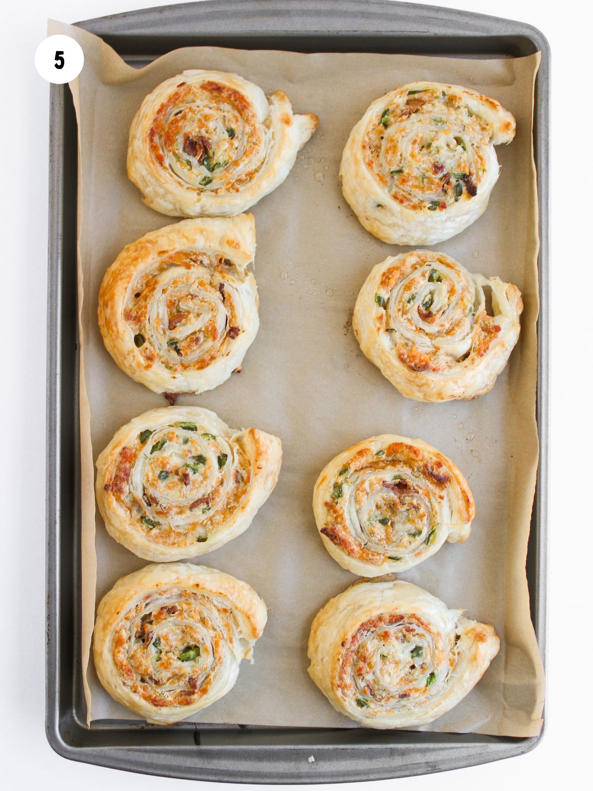 baked jalapeno popper pinwheels on baking sheet
