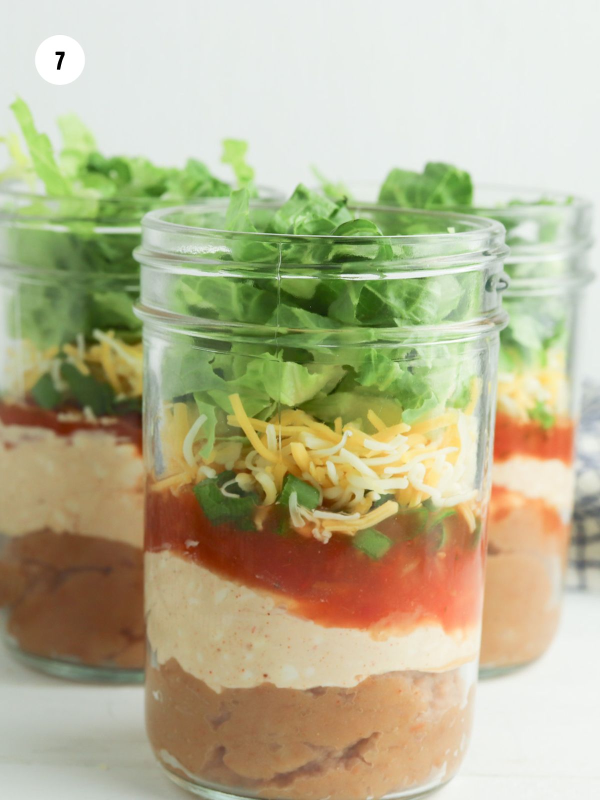 shredded lettuce added on top of the cheese