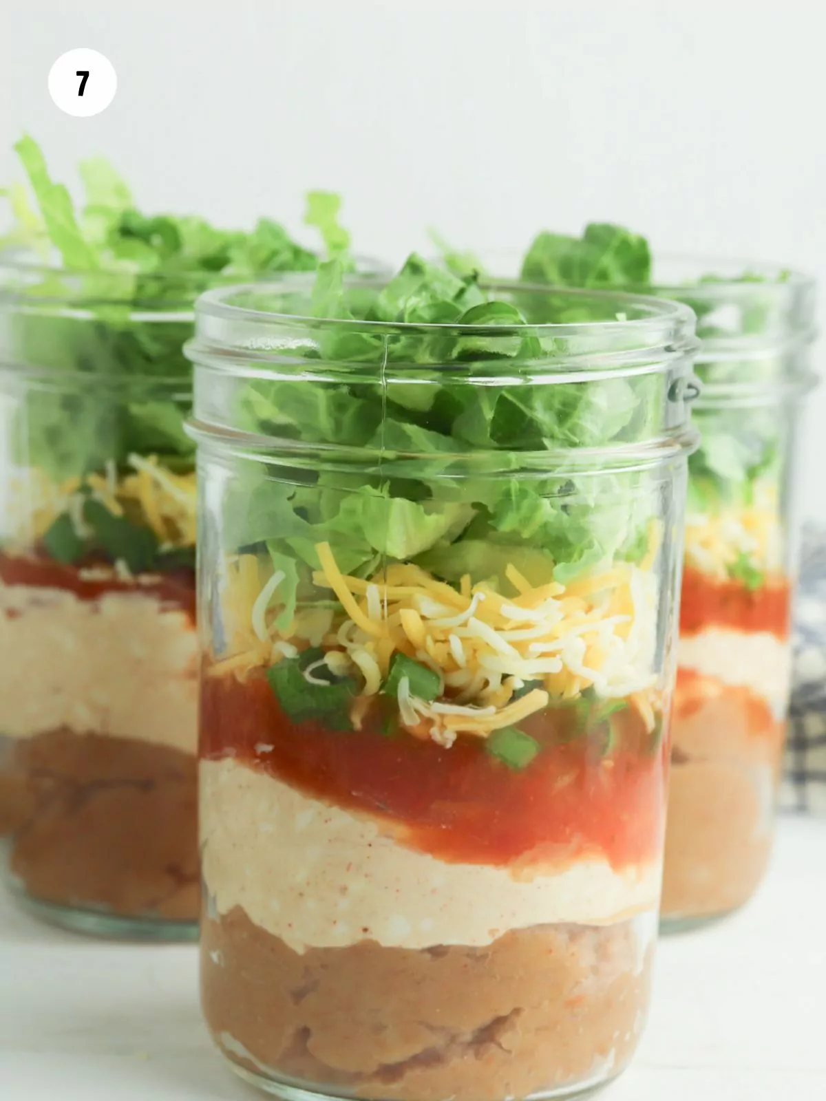 shredded lettuce added on top of the cheese