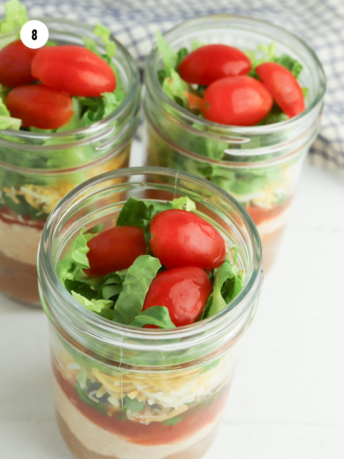 3 cherry tomatoes added on top of the shredded lettuce