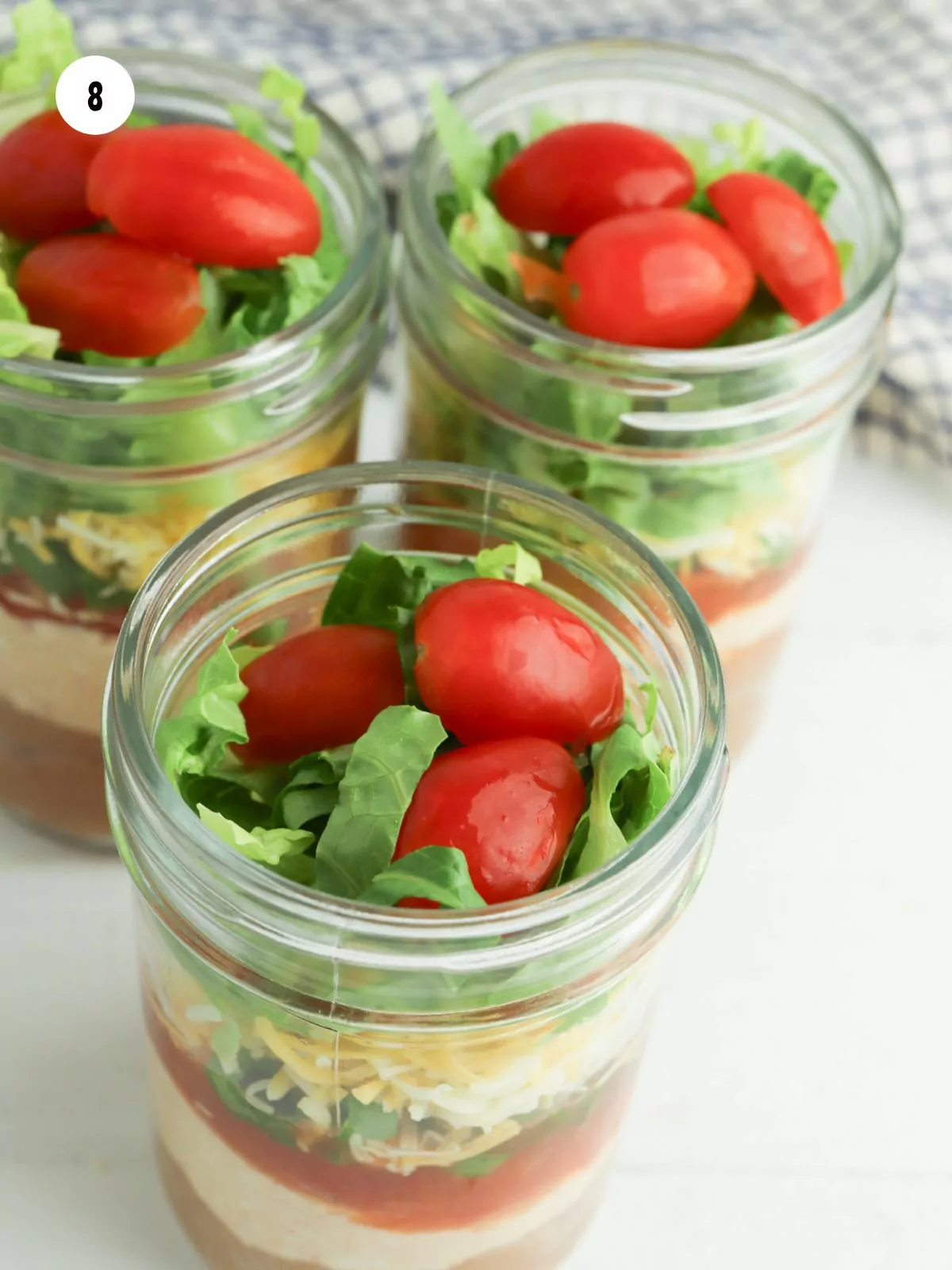 3 cherry tomatoes added on top of the shredded lettuce