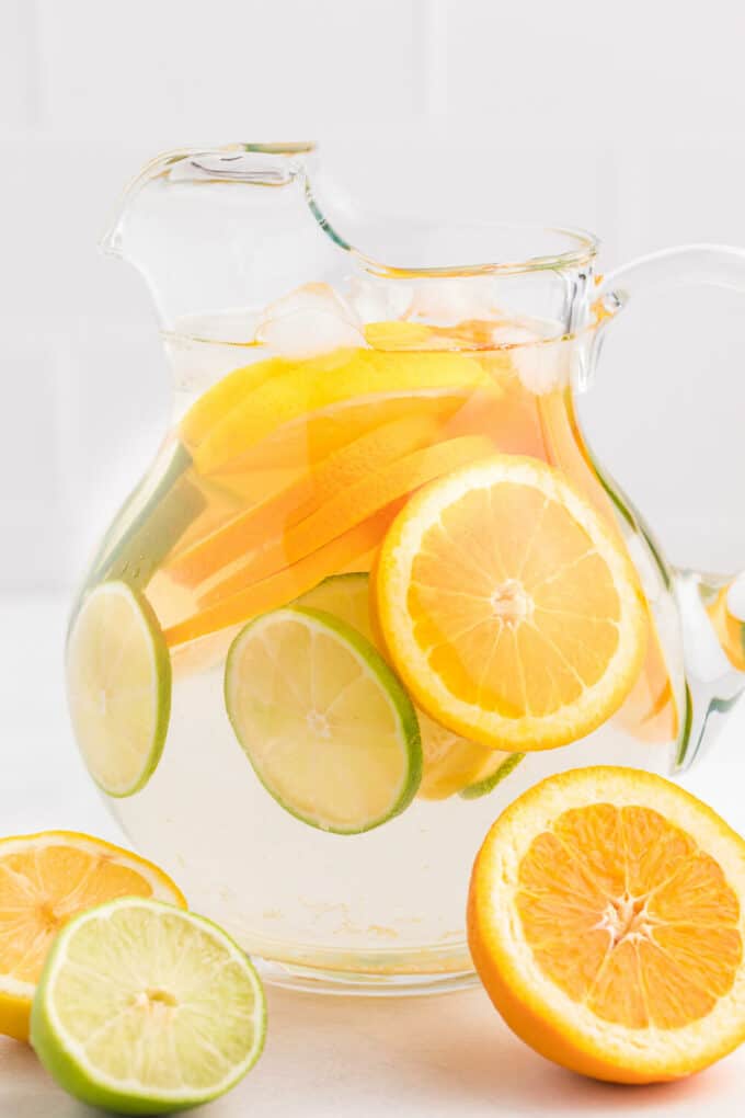 pitcher of water with lemon and lime