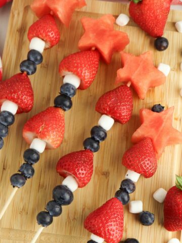4th of July Fruit Kabobs with blueberries, mini marshmallows, strawberries, and watermelon.