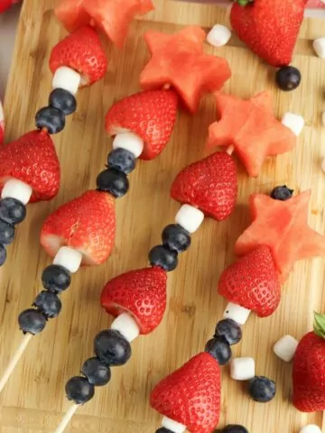 4th of July Fruit Kabobs with blueberries, mini marshmallows, strawberries, and watermelon.