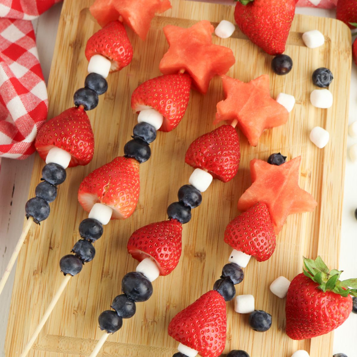 4th of July Fruit Kabobs with blueberries, mini marshmallows, strawberries, and watermelon.