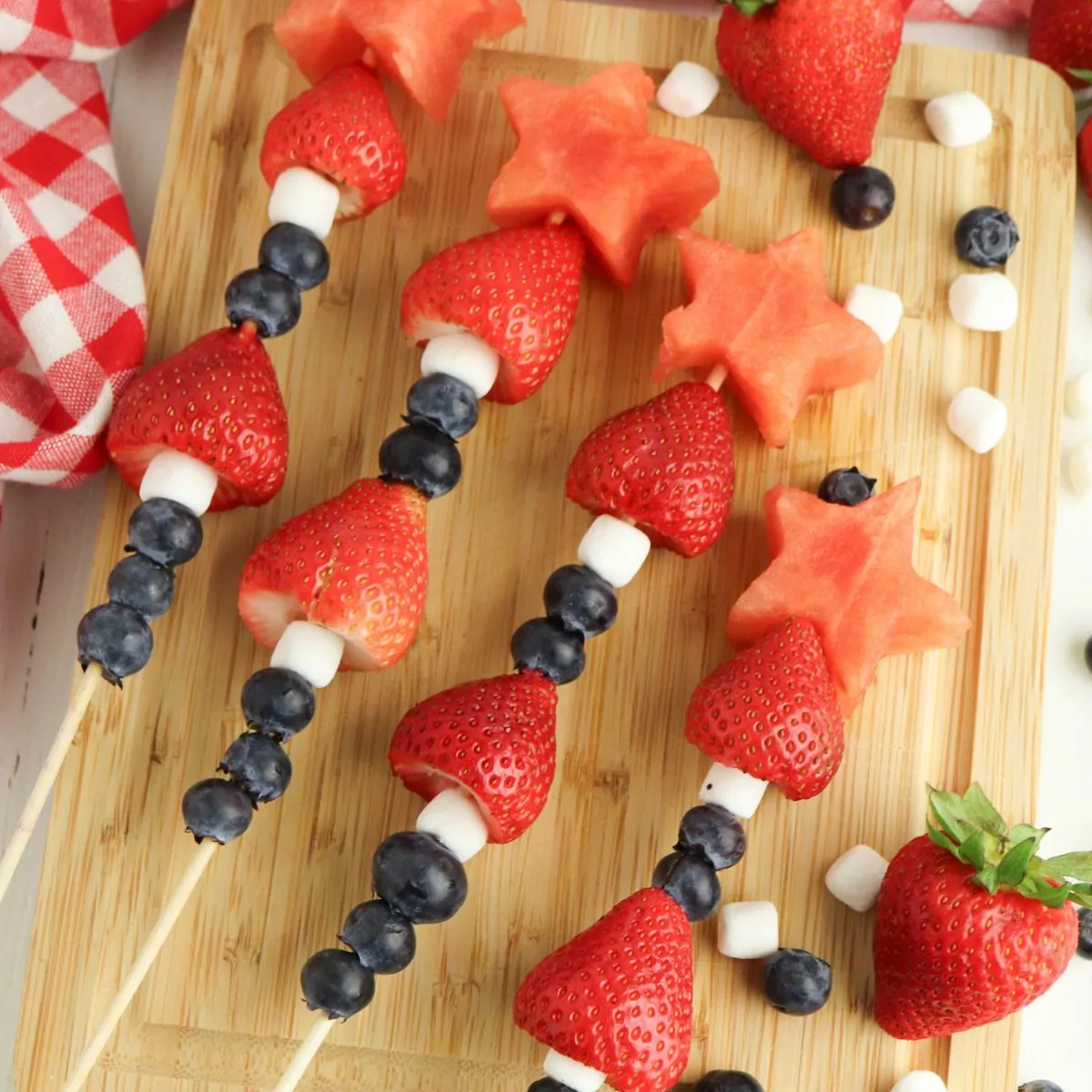 4th of July Fruit Kabobs with blueberries, mini marshmallows, strawberries, and watermelon.