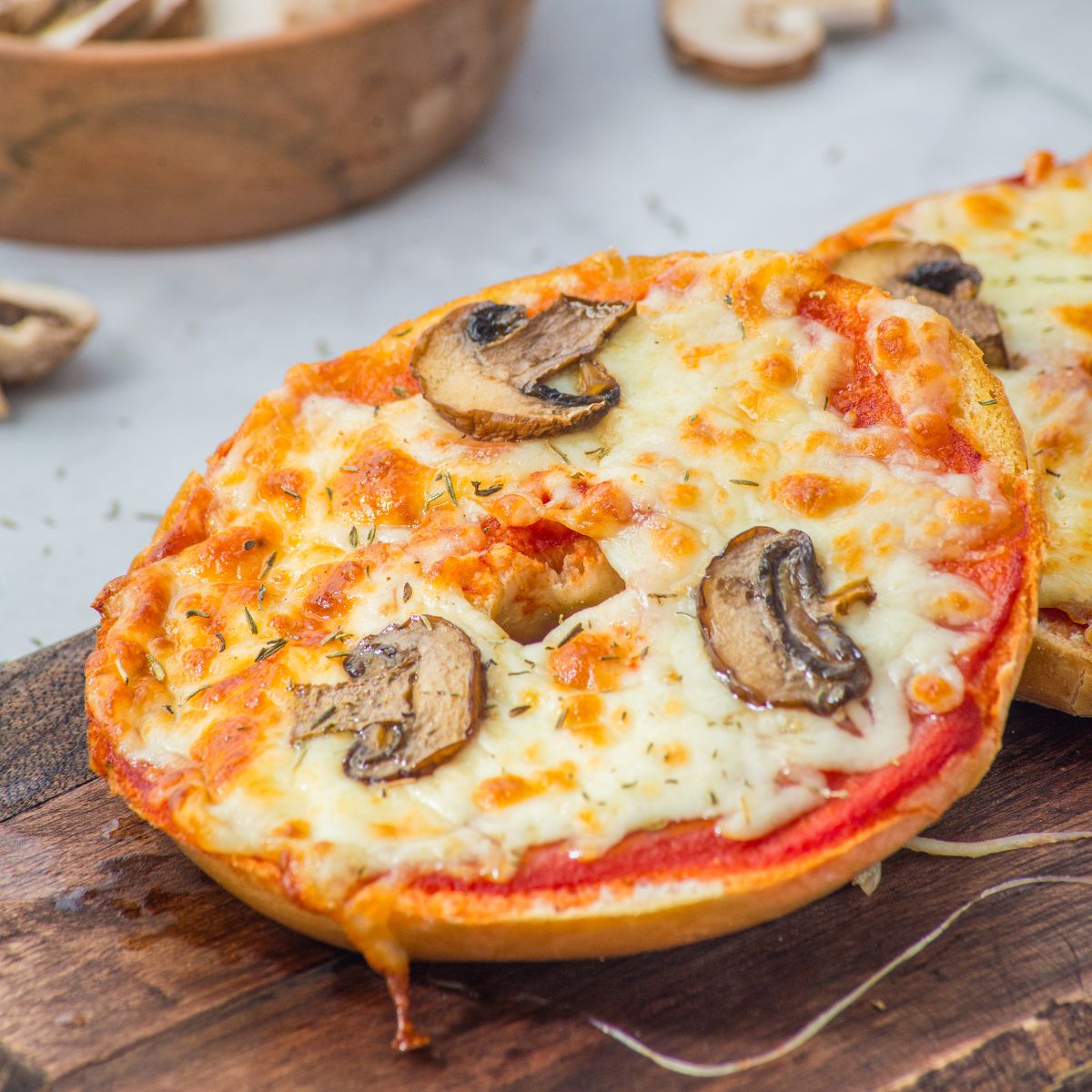 Air Fryer Pizza Bagels with mushrooms.