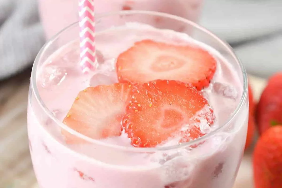 glass of Keto Pink Drink with slice of strawberry