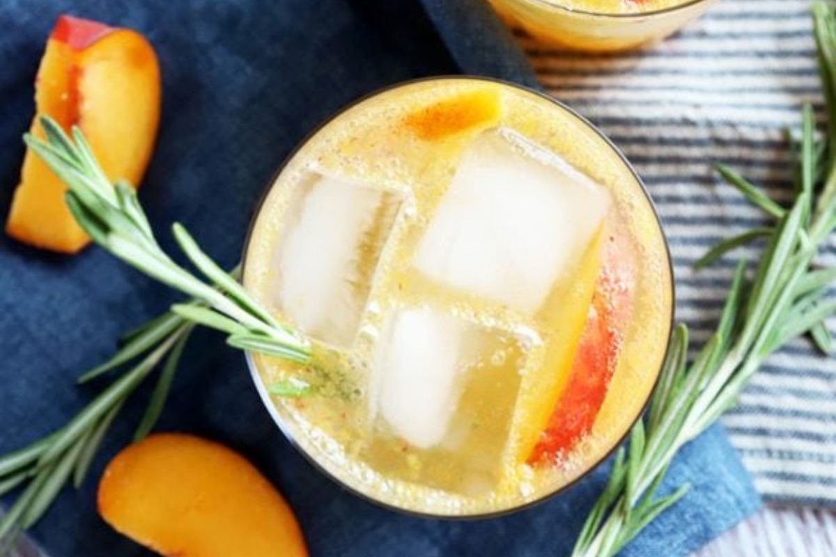 glass of Sparkling Rosemary Peach Mocktail