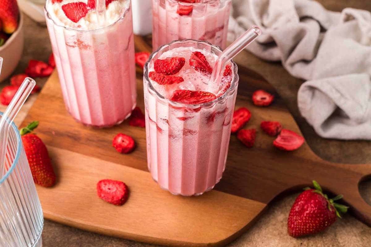 three glass of Starbucks Copycat Pink Drink with strawberry toppings