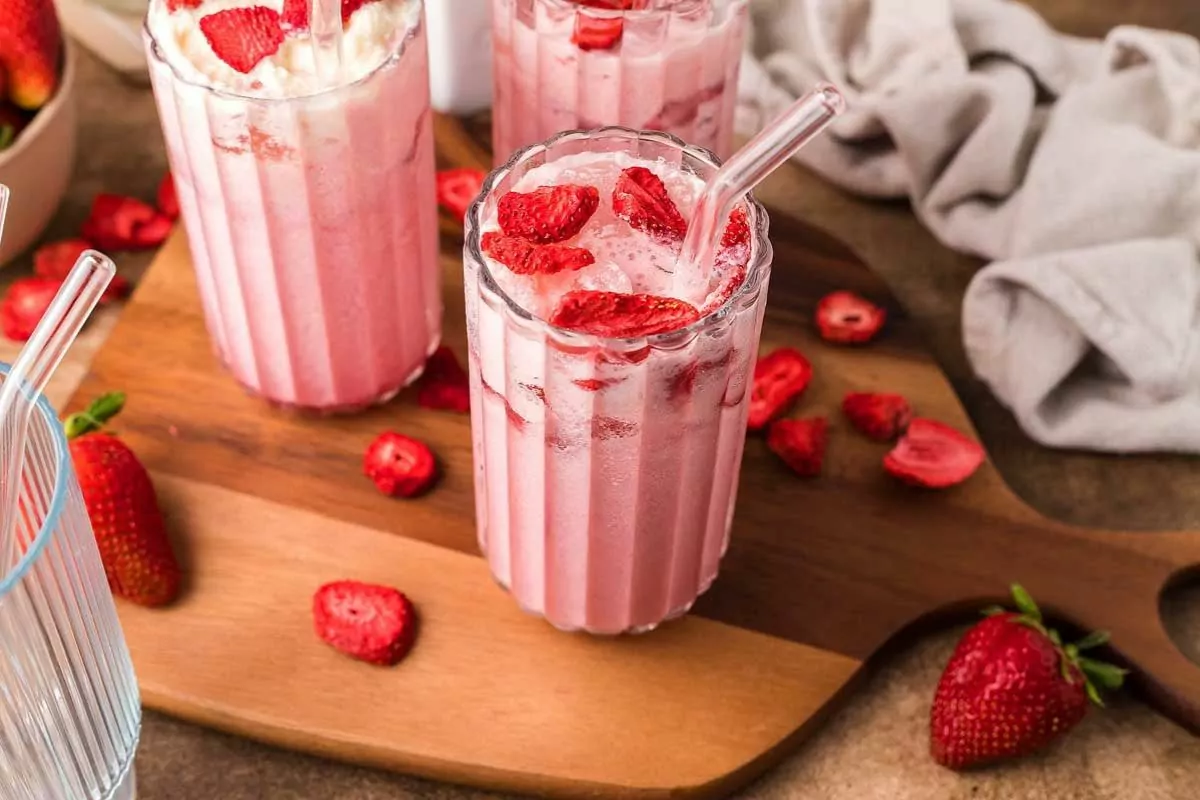 three glass of Starbucks Copycat Pink Drink with strawberry toppings