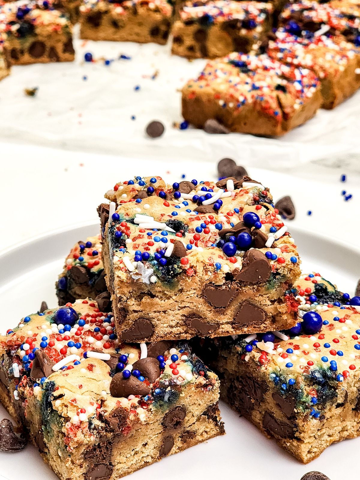 4th of July Chocolate Chip Bar Cookies stacked showing the cookies filled with chocolate chips on the inside.