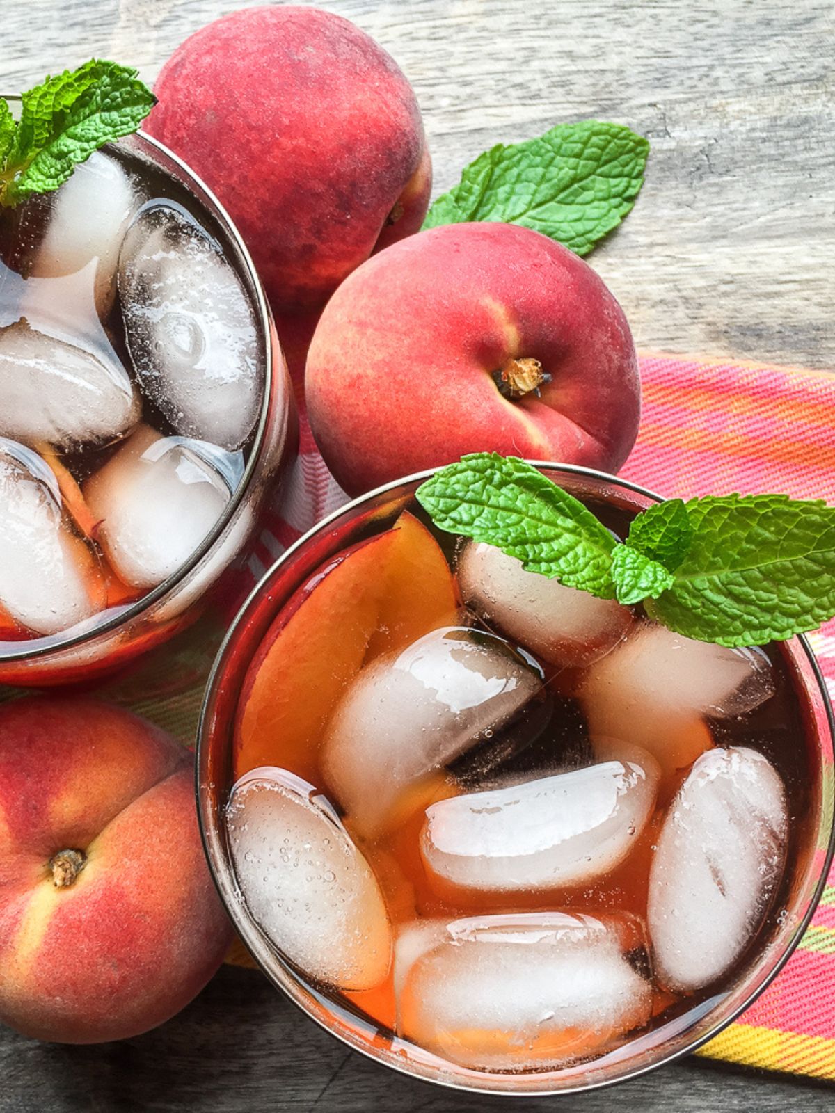 overhead view of iced tea made with fresh peaches and mint.