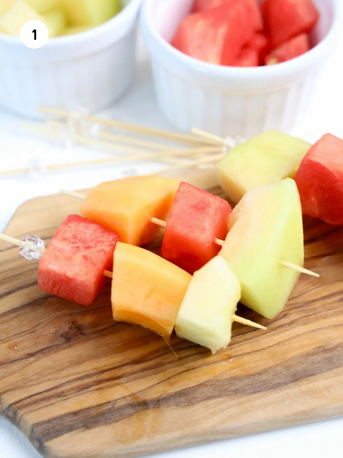 Skewers of watermelon, cantaloupe, and honey dew melon.