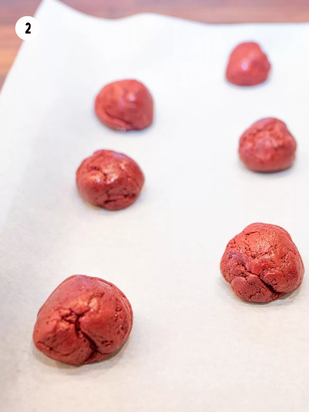 cookie balls on baking sheet.