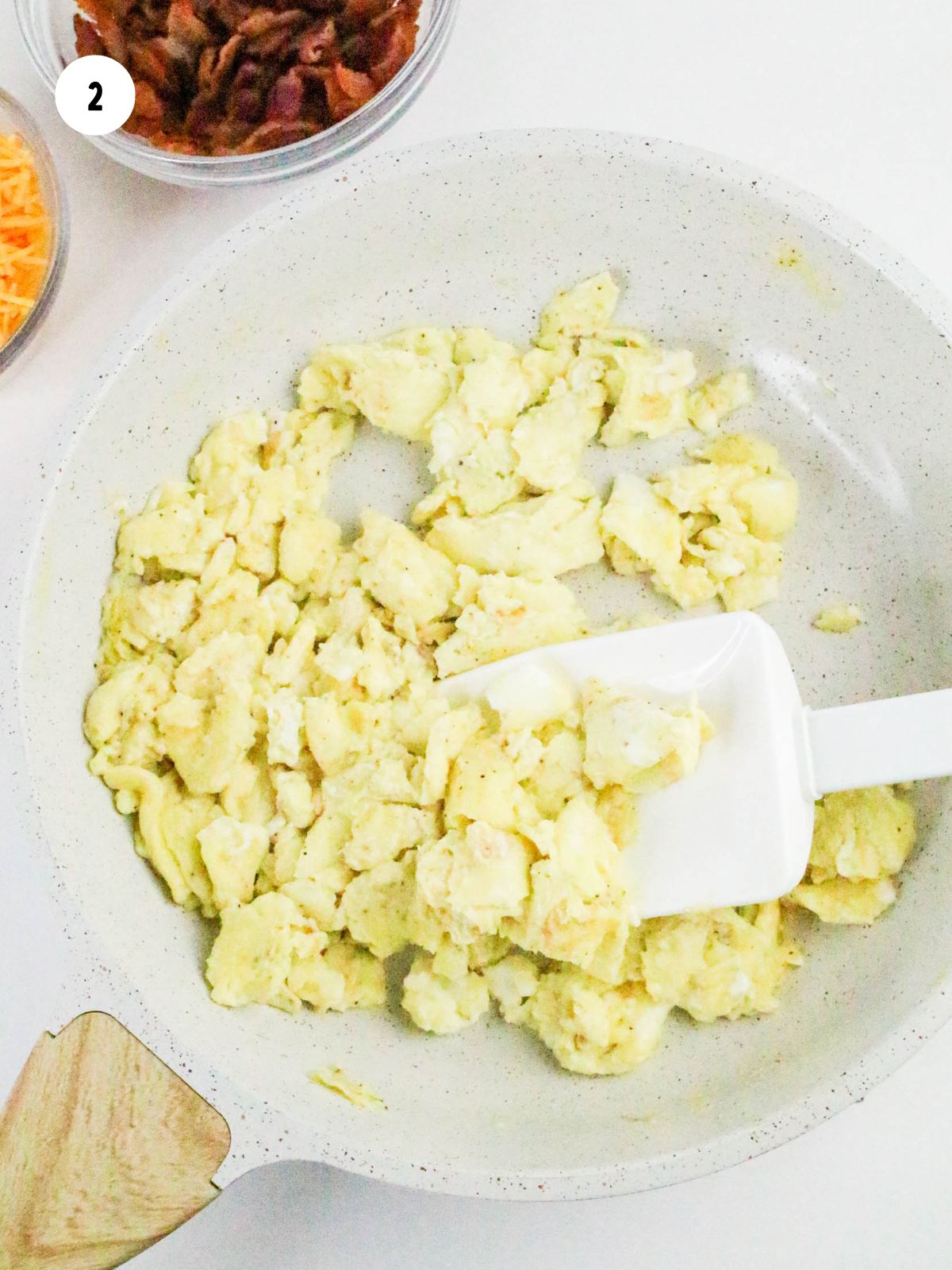 Scrambled eggs in a pan.