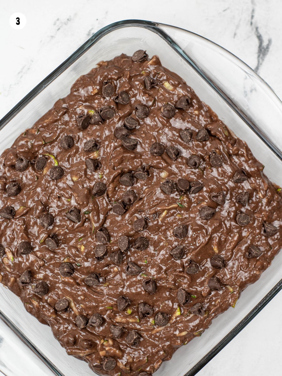 Add batter to baking dish and top with chocolate chips.