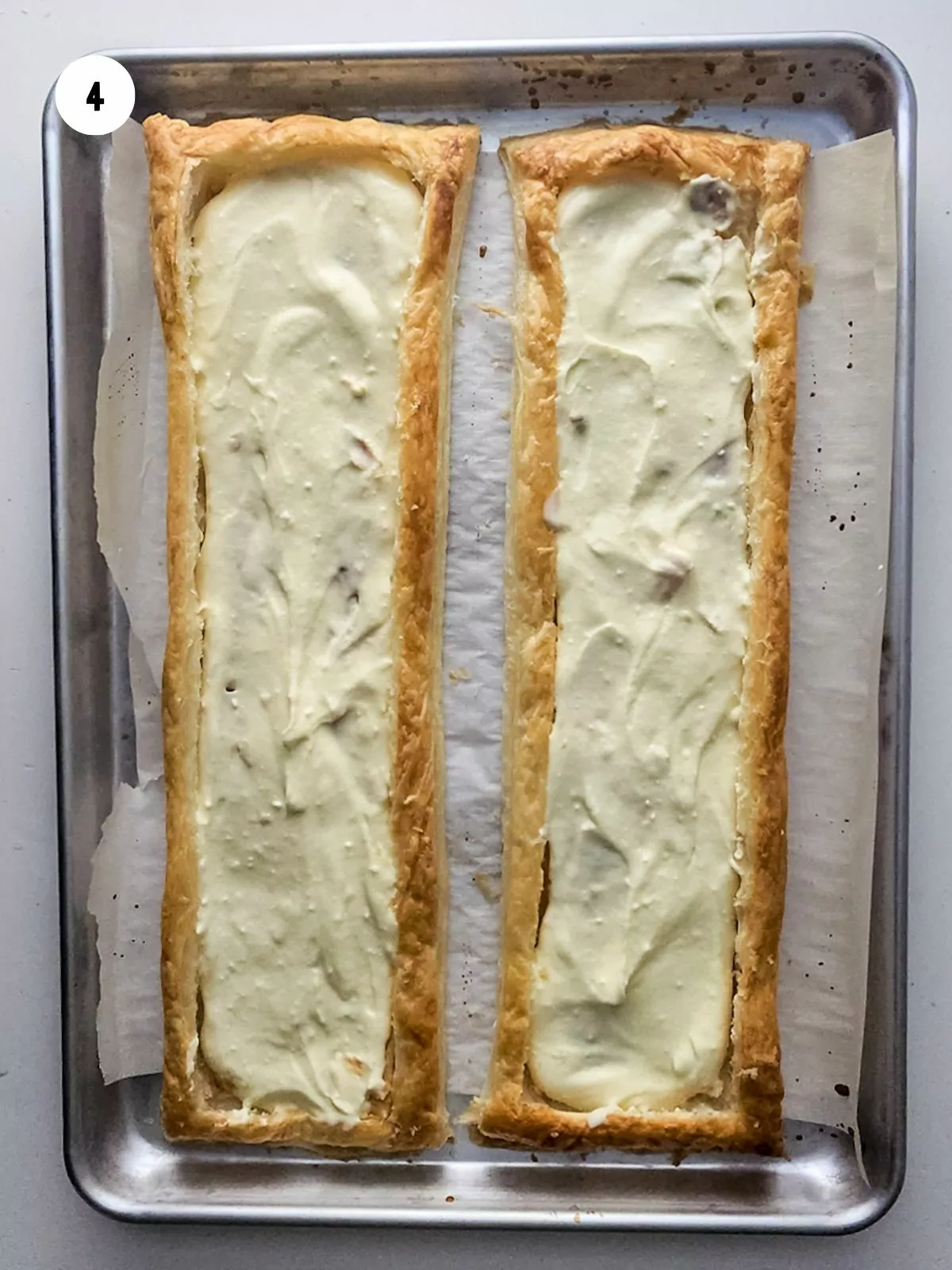 Cream cheese mixture added to the baked puff pastry.