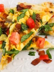 Slices of breakfast flatbread served on a white plate.