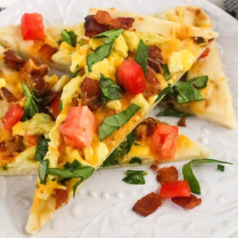 Slices of breakfast flatbread served on a white plate.