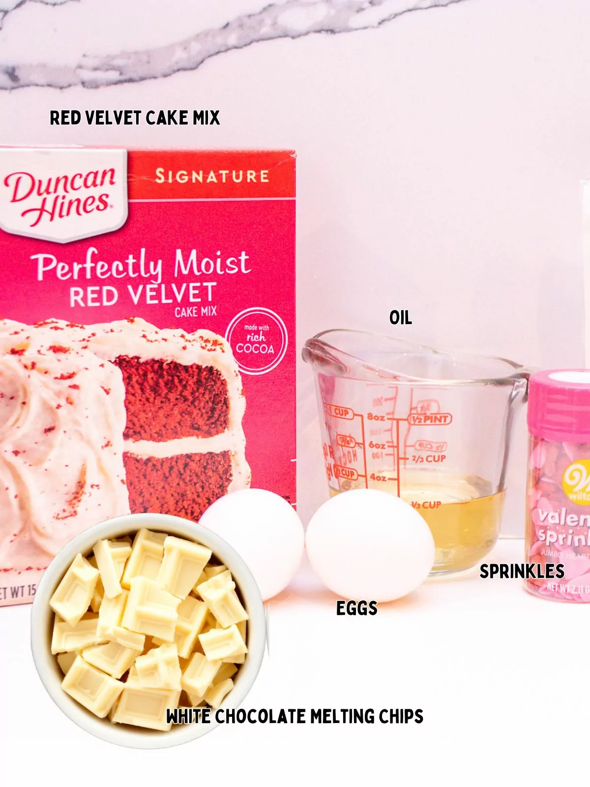 Ingredients to make Duncan Hines Red Velvet Cookies.