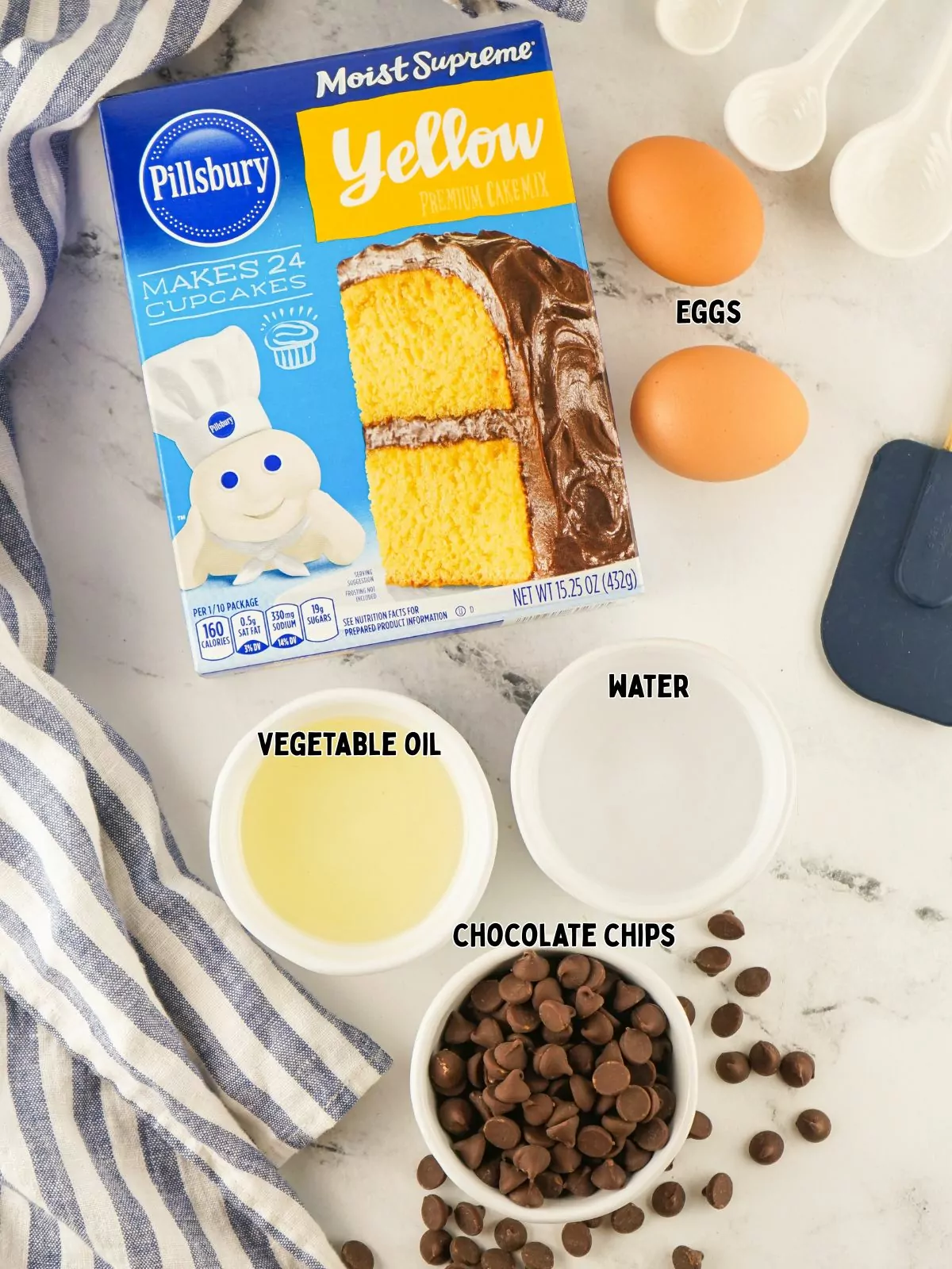 Ingredients of yellow cake mix, vegetable oil, water, chocolate chips and eggs.